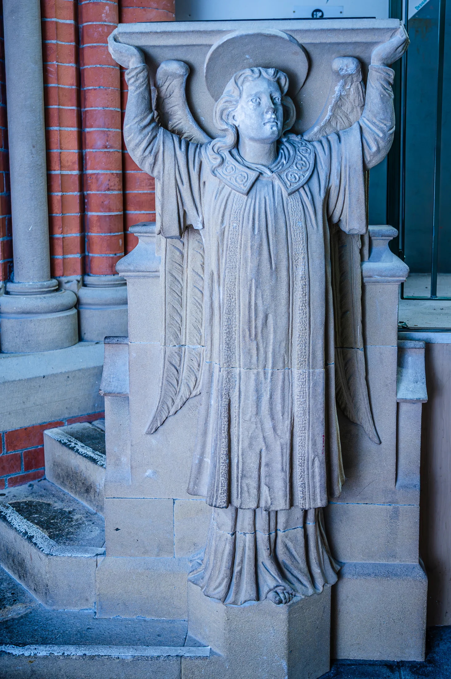 A carved angel figure against the church interior