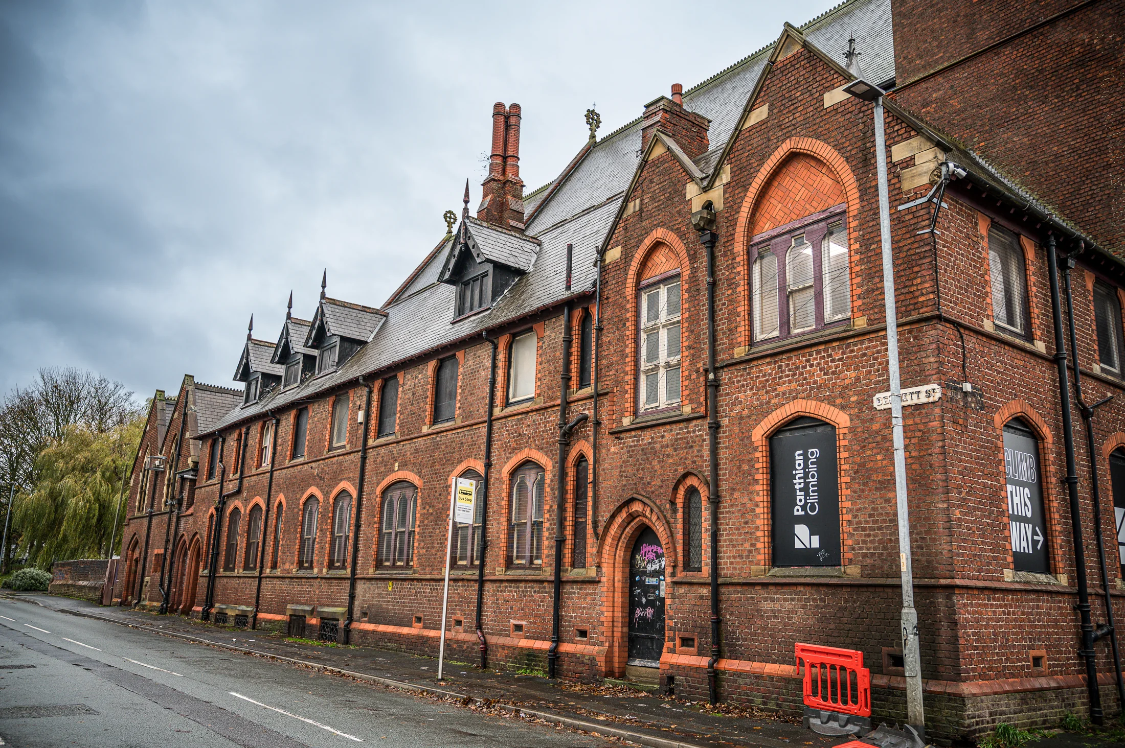 The church and adjoining rooms viewed along the pavement