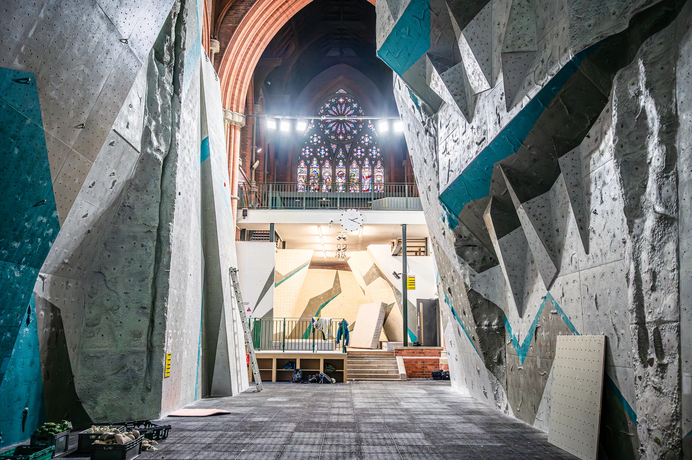 Climbing walls within the church, beneath the brick arches and timber roof